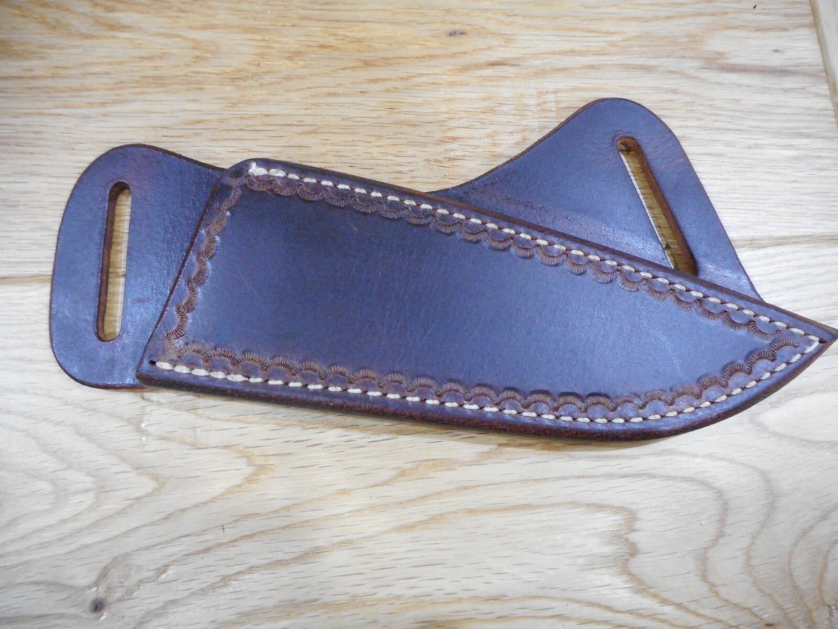 Cross draw leather sheath for 5 inch and shorter knives.