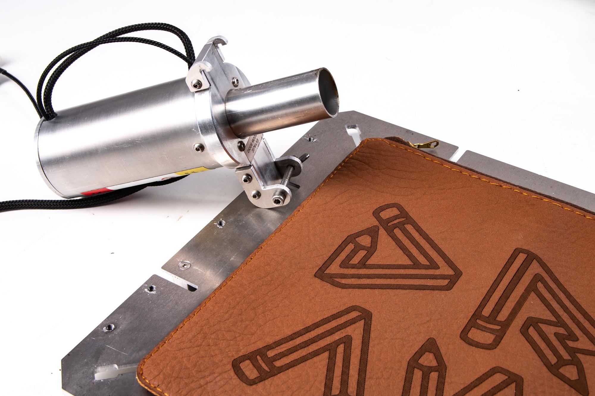 Laser engraving and cutting leather